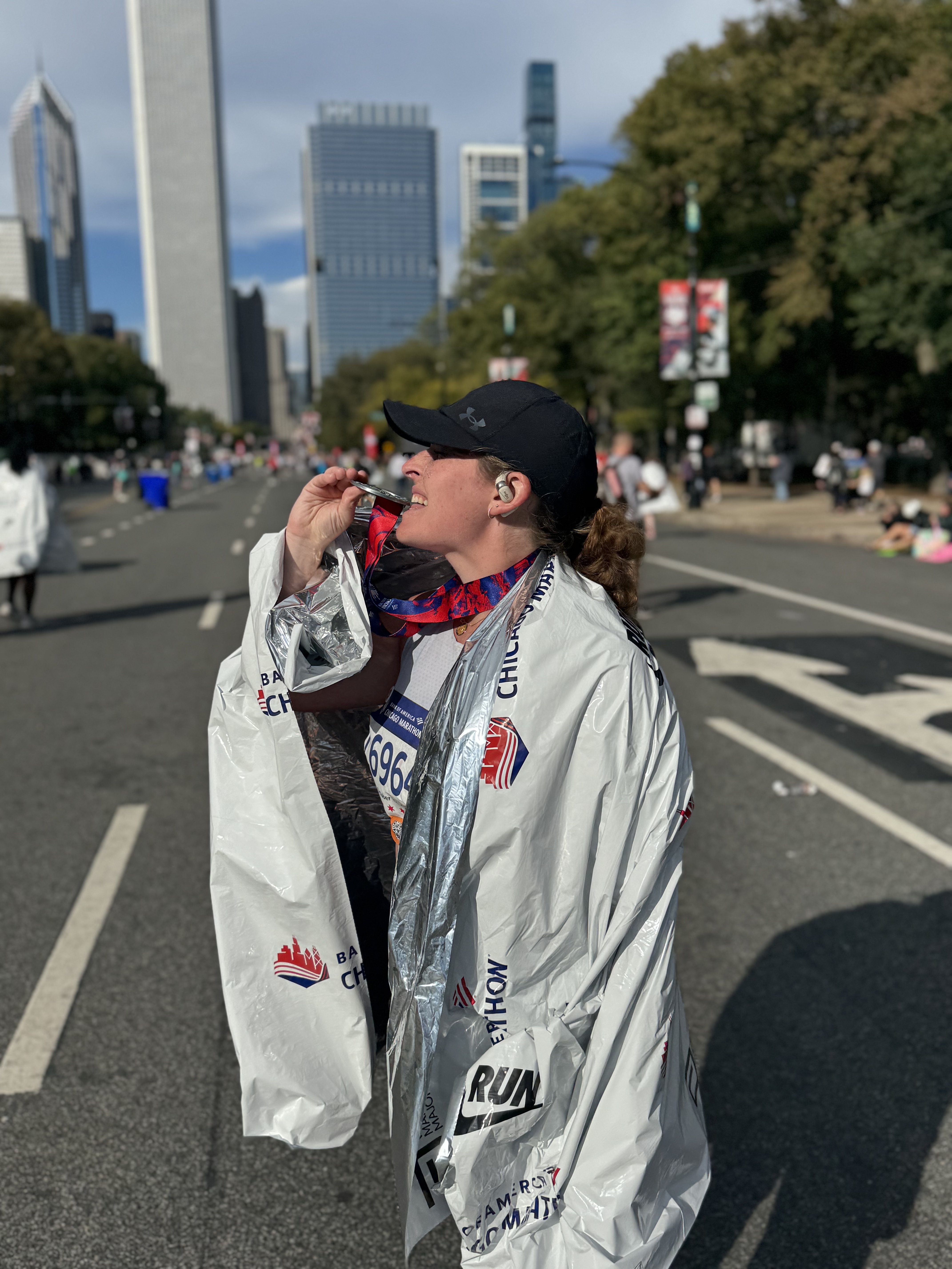 Liz at Chicago Marathon with skyline